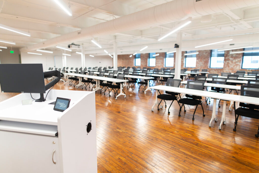 Congdon Yards 3rd Floor Engine Room podium facing meeting space