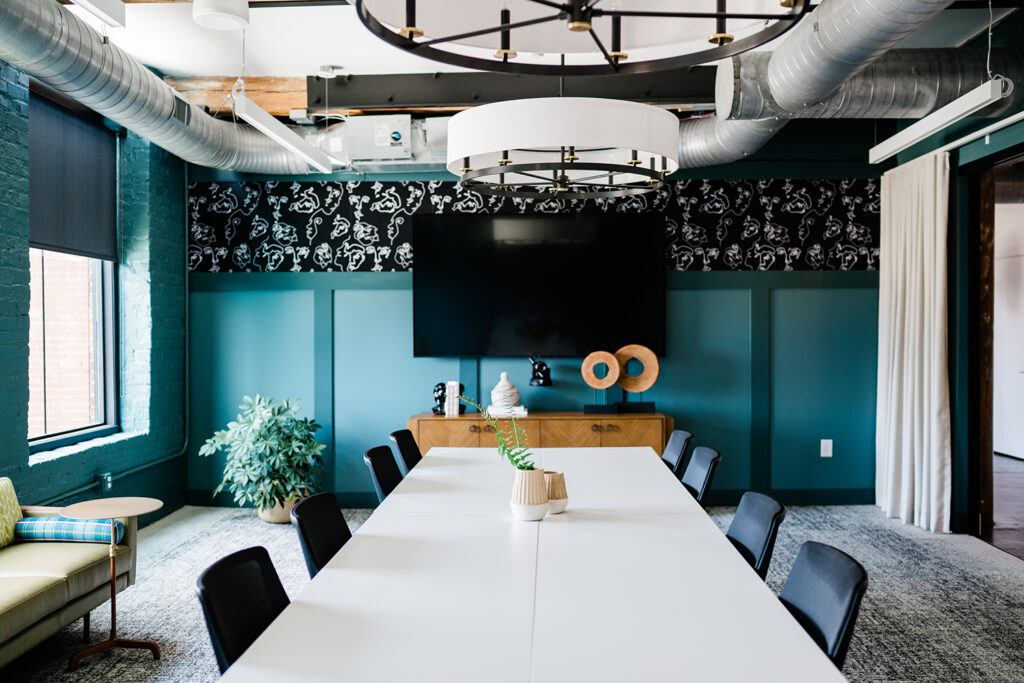 Congdon Yards 3rd Floor Pattern Room tv at the end of long conference table