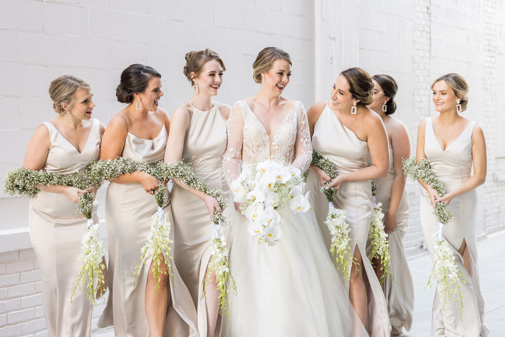 Congdon Yards Outside bride and bridemaids holding flowers