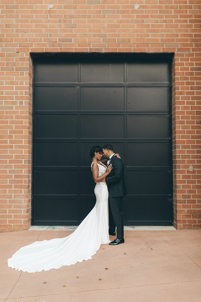 Congdon Yards Outside couple in front of black door and brick wall