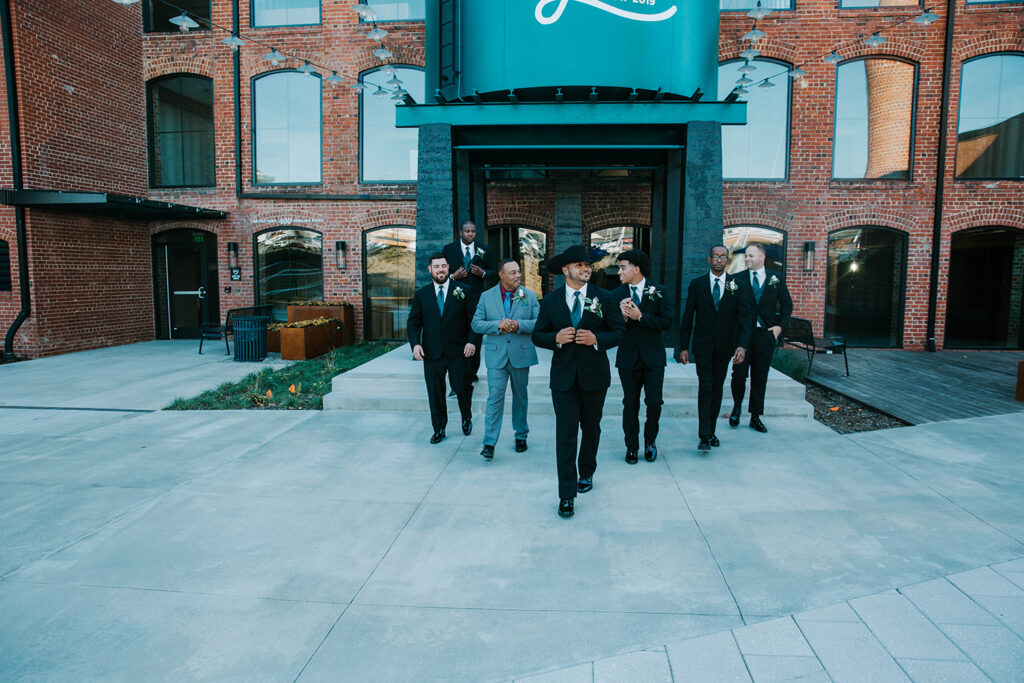 Congdon Yards Outside groom and groomsmen by water tower 