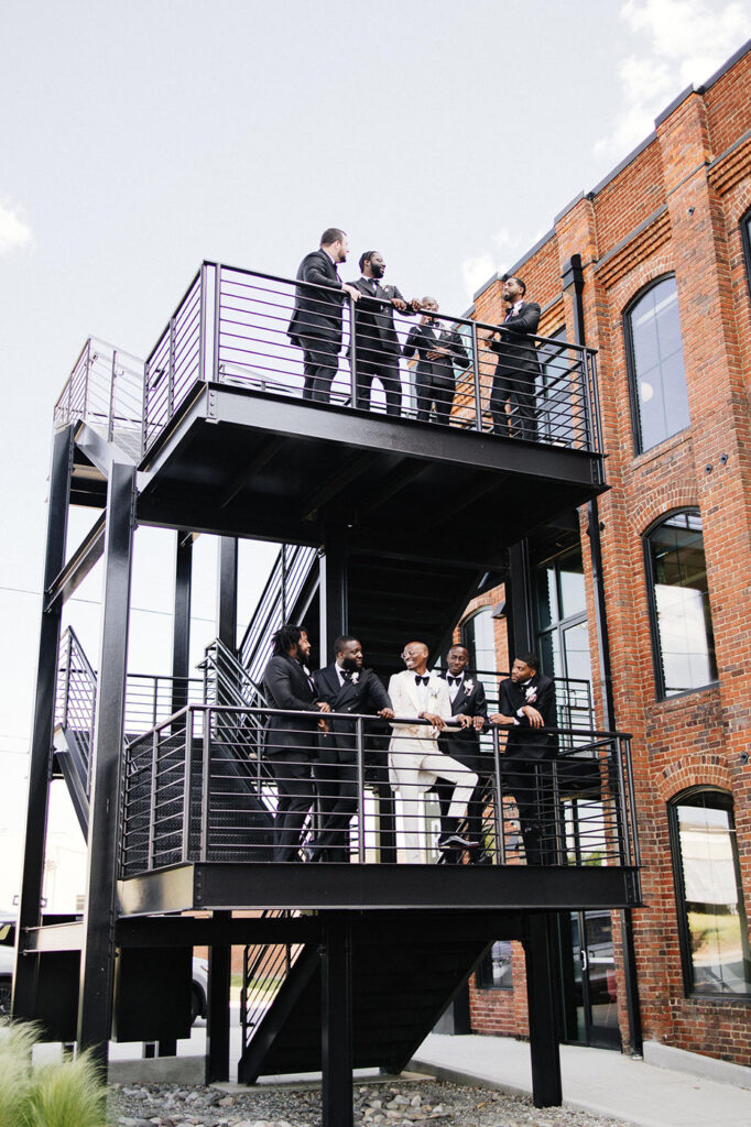 Congdon Yards Outside groomsmen by staircase