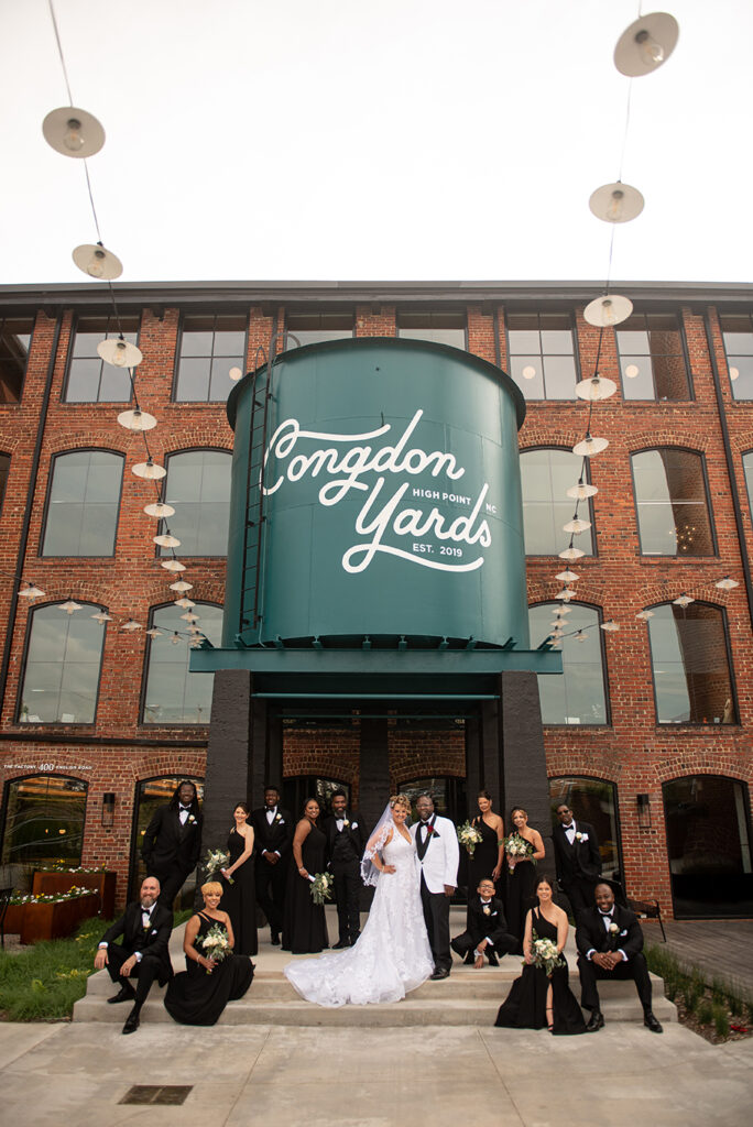 Congdon Yards Outside group photo with couple under water tower