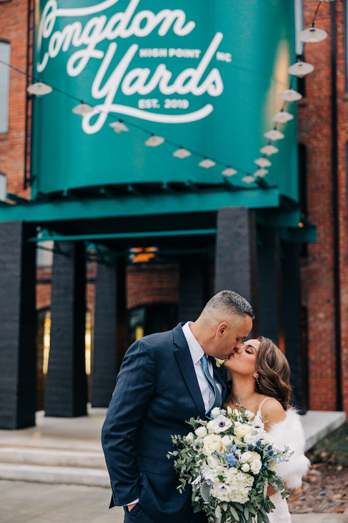 Congdon Yards Outside wedding couple kissing