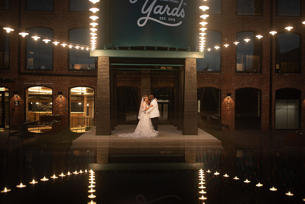 Congdon Yards Outside wedding couple under hanging lights at night