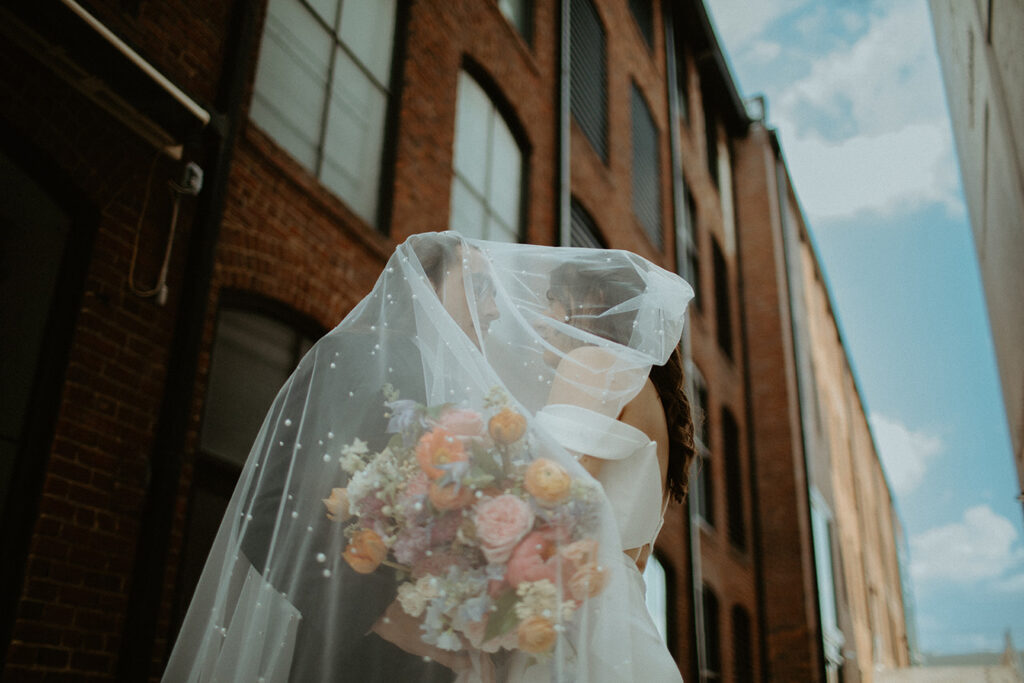 Congdon Yards Outside wedding couple under veil