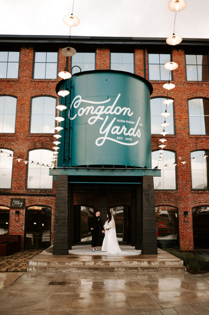 Congdon Yards Outside wedding couple under water tower and lights