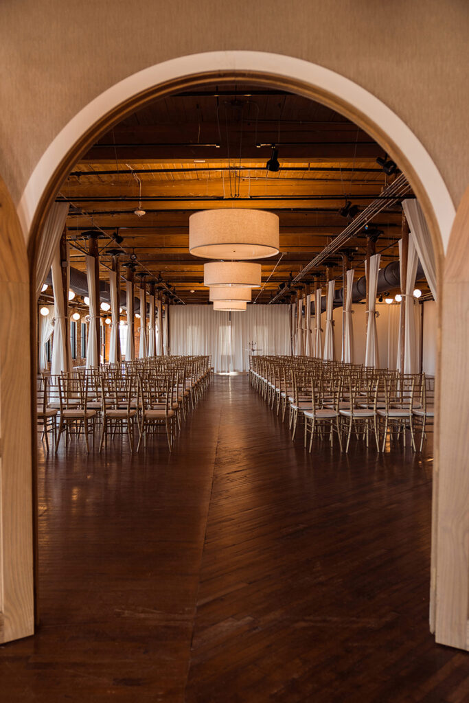 Congdon Yards Pine Room at the Loft arched doorway leading to wedding ceremony room