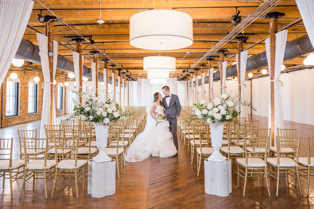 Congdon Yards Pine Room at the Loft couple walking down aisle exit