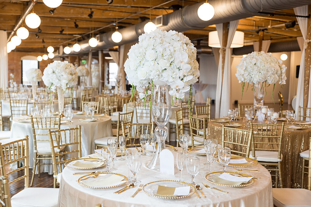 Congdon Yards Pine Room at the Loft glamorous wedding reception banquet tables with white roses