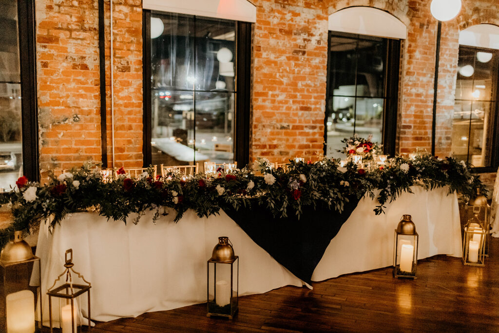 Congdon Yards Pine Room at the Loft head table with greenery