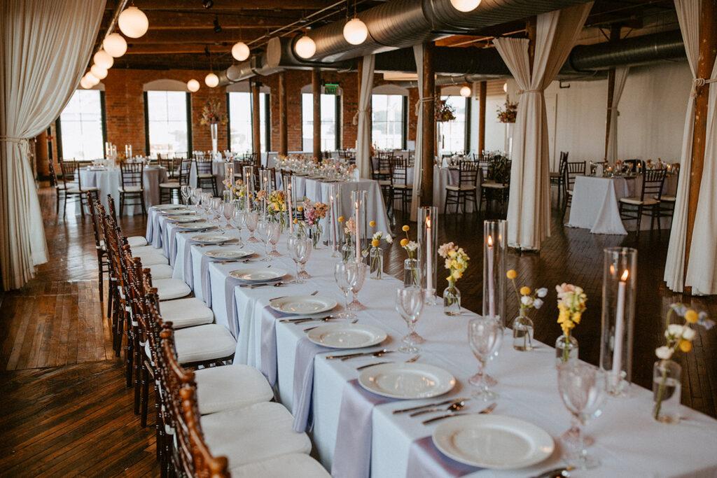 Congdon Yards Pine Room at the Loft long banquet table with minimal flowers