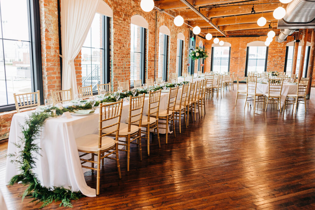 Congdon Yards Pine Room at the Loft long reception table with greenery