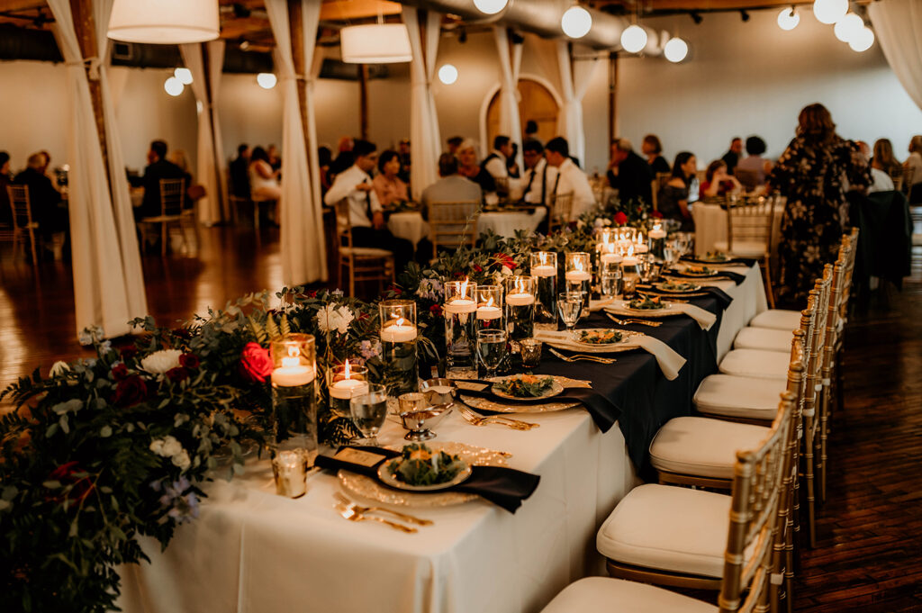 Congdon Yards Pine Room at the Loft moody lighting at wedding reception table with candles