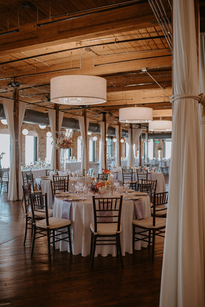 Congdon Yards Pine Room at the Loft round banquet tables with florals