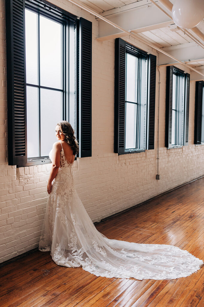 Congdon Yards silk room at the loft bride gazing out window