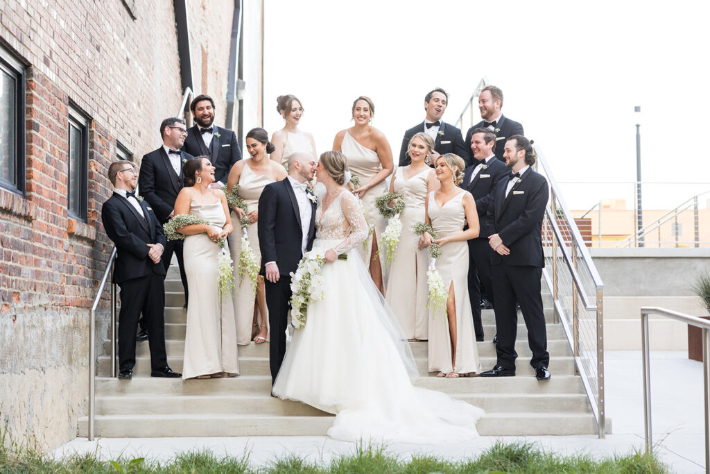 congdon yards courtyard bridal party posing on stairs