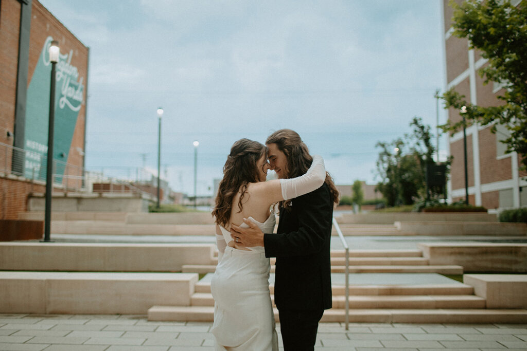 congdon yards courtyard bride and groom kissing