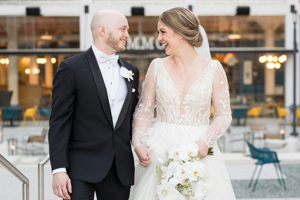 congdon yards courtyard bride and groom looking at each other