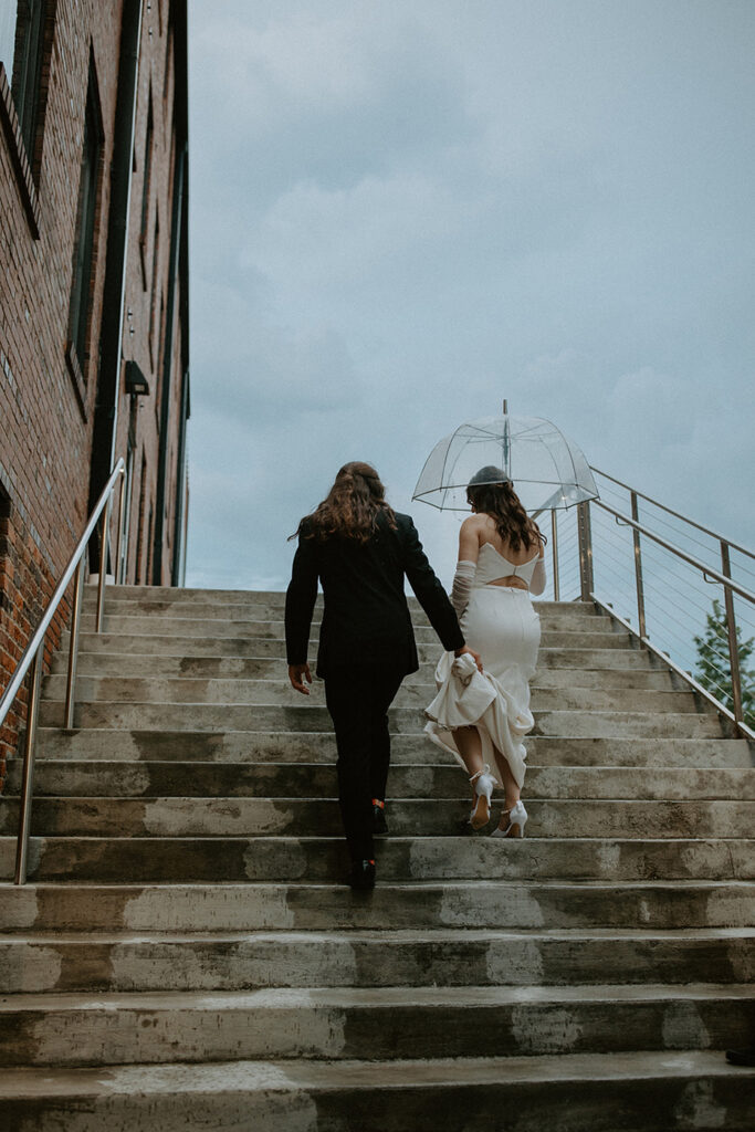 congdon yards courtyard bride and groom walking up stairs