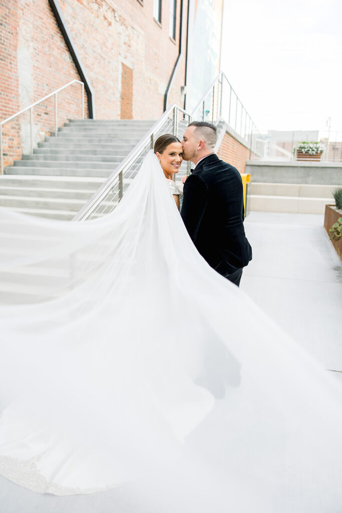 congdon yards courtyard bride and groom with dramatic veil