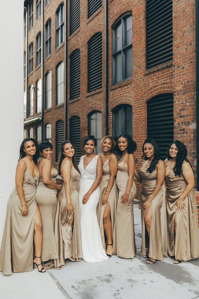 congdon yards courtyard stunning bride posing with bridesmaids