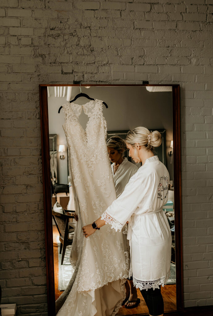 congdon yards luxe suite bride looking at dress