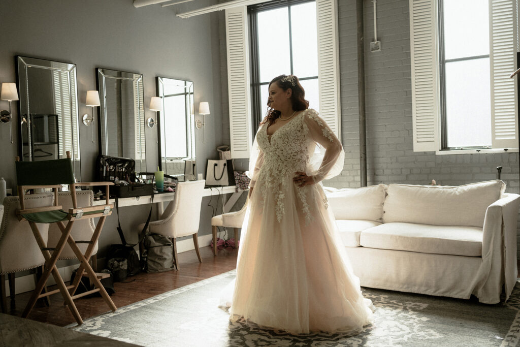 congdon yards luxe suite bride posing in wedding dress