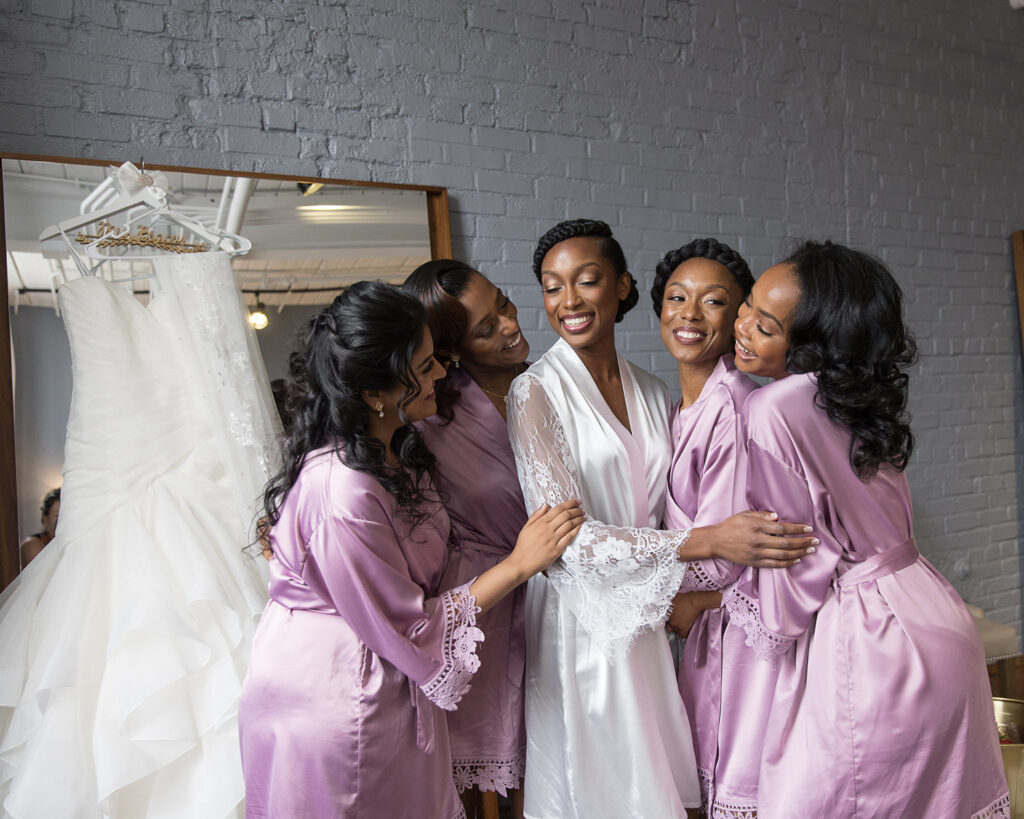 congdon yards luxe suite bridesmaids looking at bride