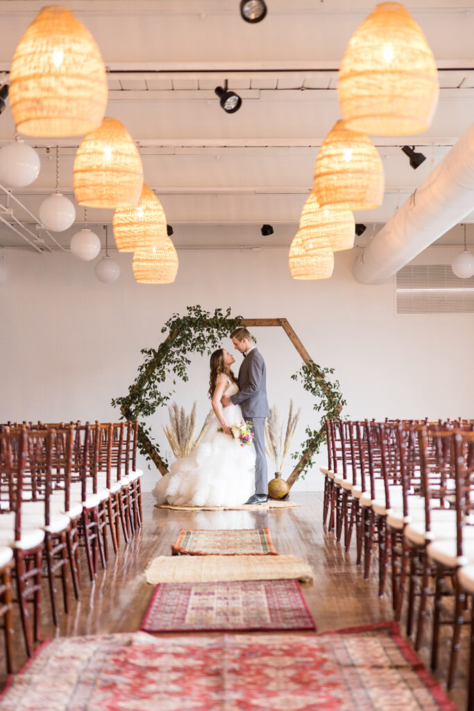 congdon yards silk room at the loft bride and groom looking into each others eyes