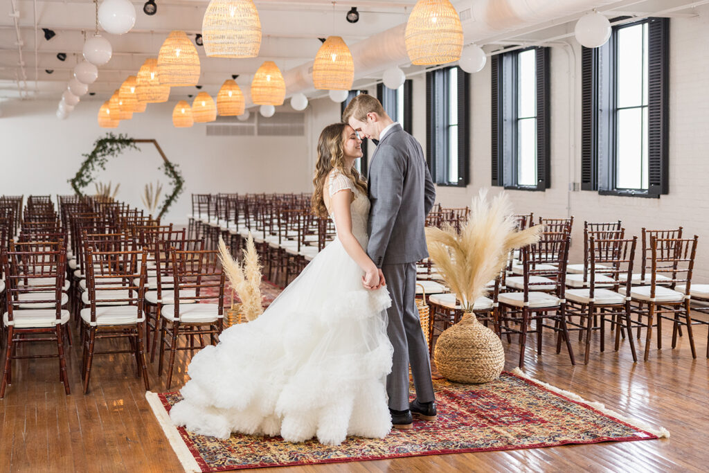 congdon yards silk room at the loft bride and groom posing