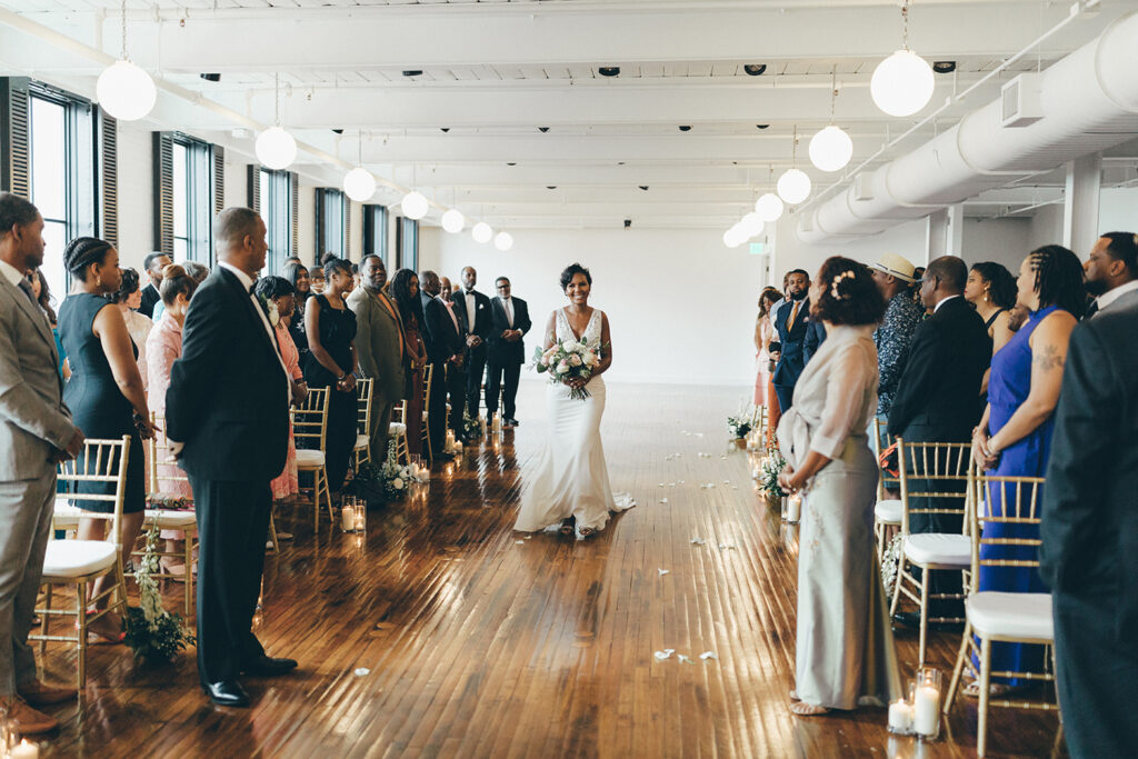 congdon yards silk room at the loft bride walking down aisle