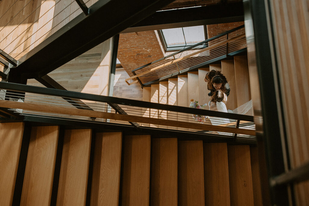 congdon yards the factory looking down stairway at bride and groom