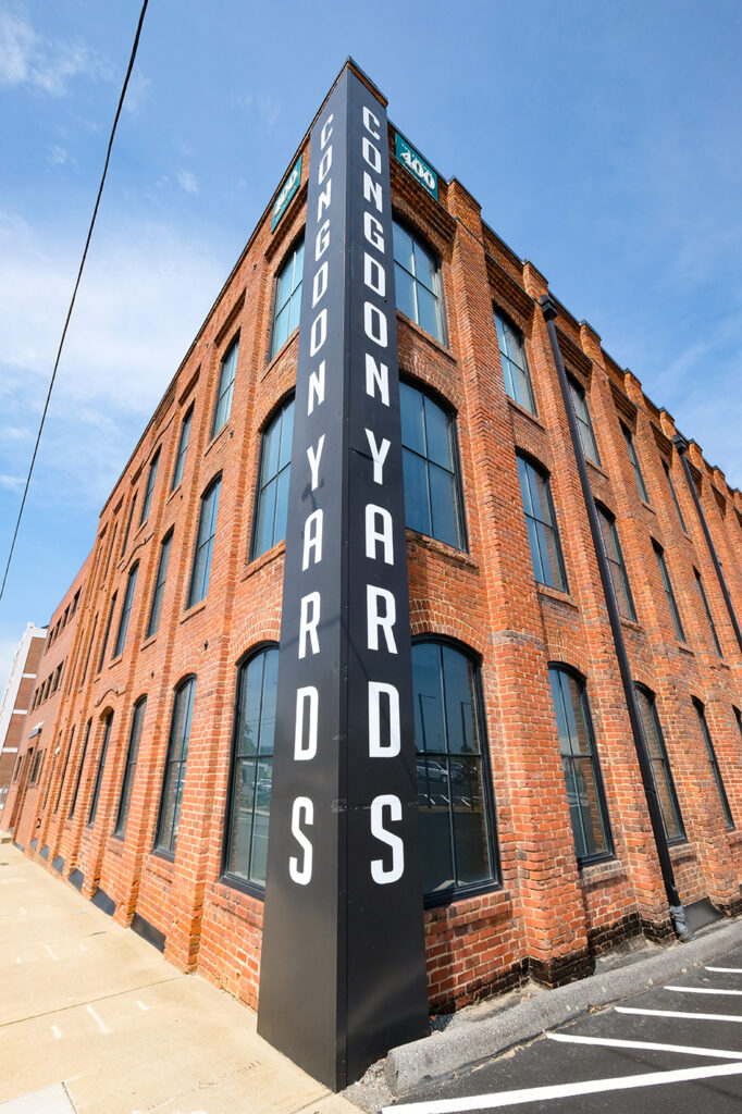 congdon yards the factory vertical sign