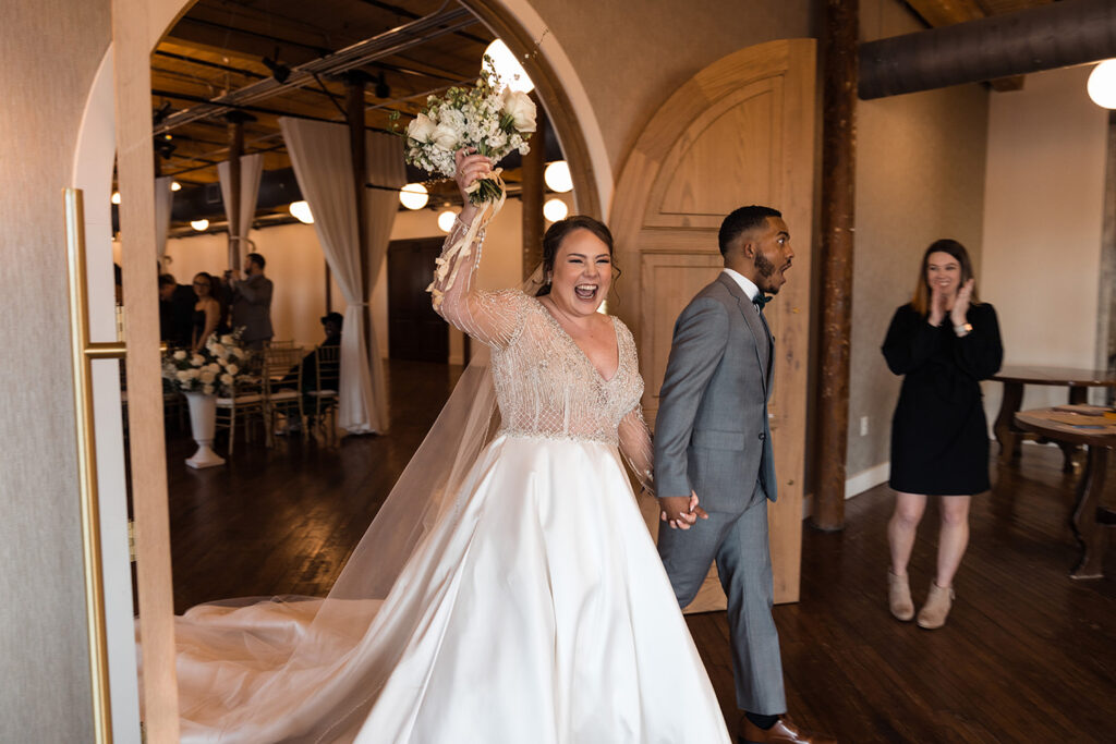 congdon yards the loft bride and groom celebrating as they exit ceremony